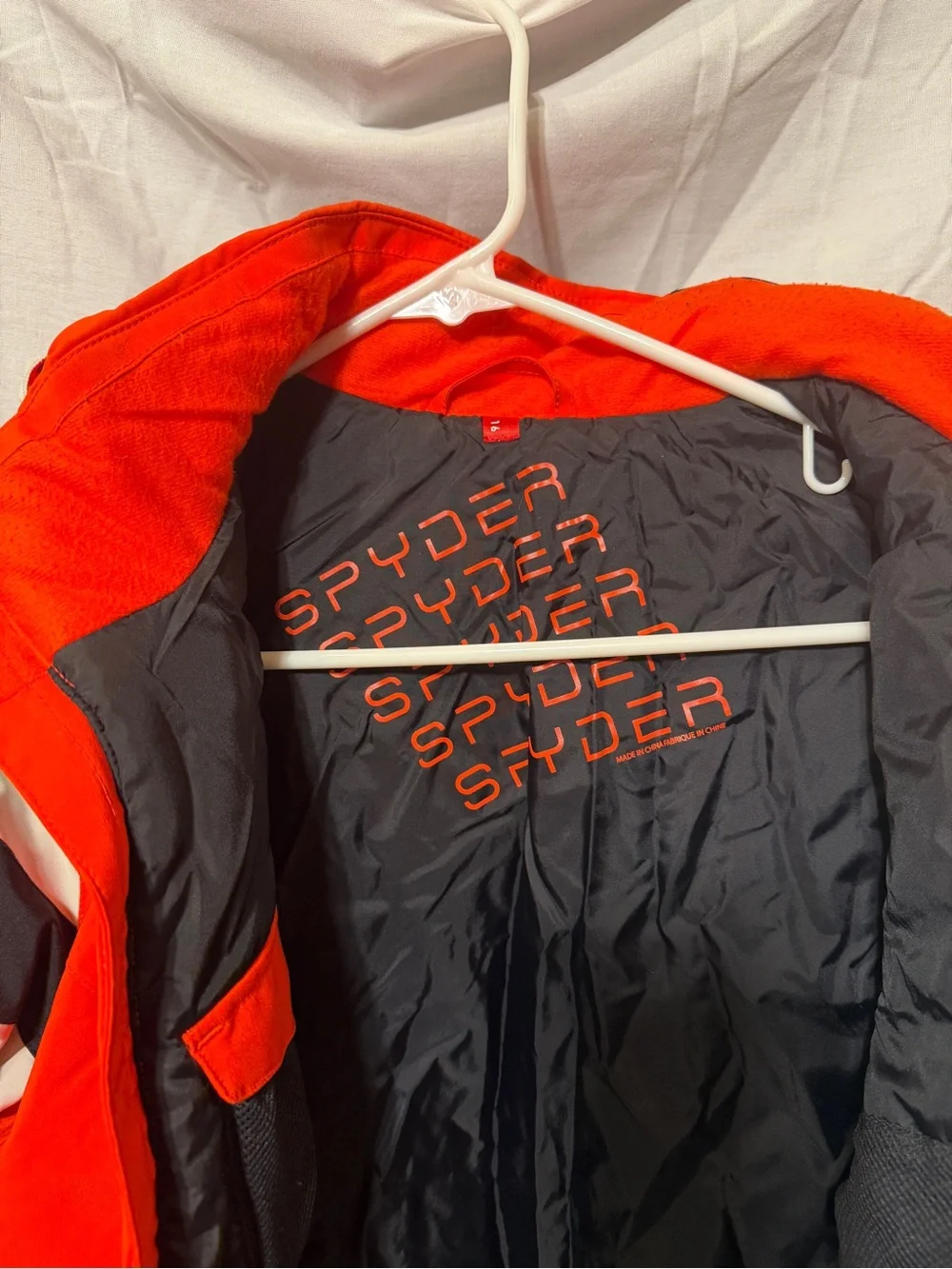 Spyder Kids Orange-Red Ski Jacket with Black & White Panels